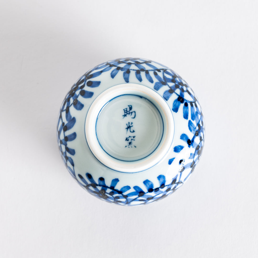 Bottom view of the Chawanmushi Bowl, highlighting the spiral pattern and the markings on the base.