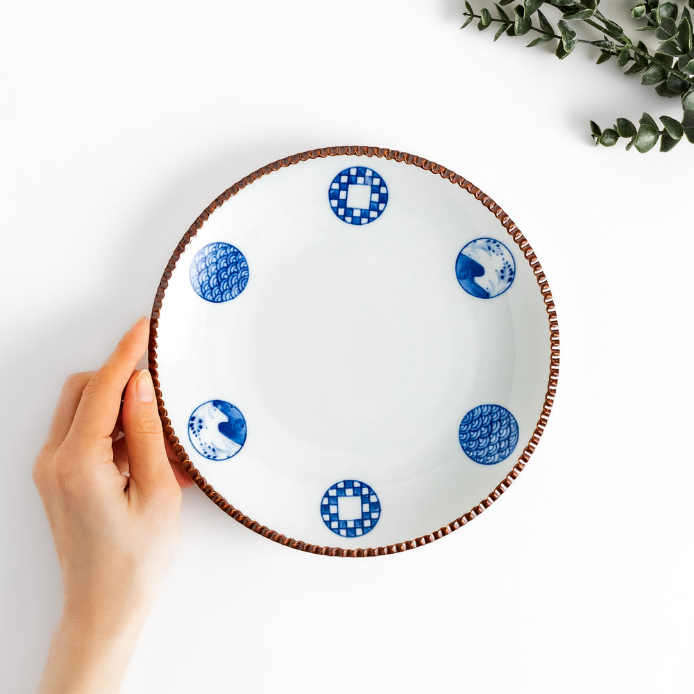 Elegant ceramic salad plate featuring a classic blue and white pattern, adding a touch of sophistication to your table.