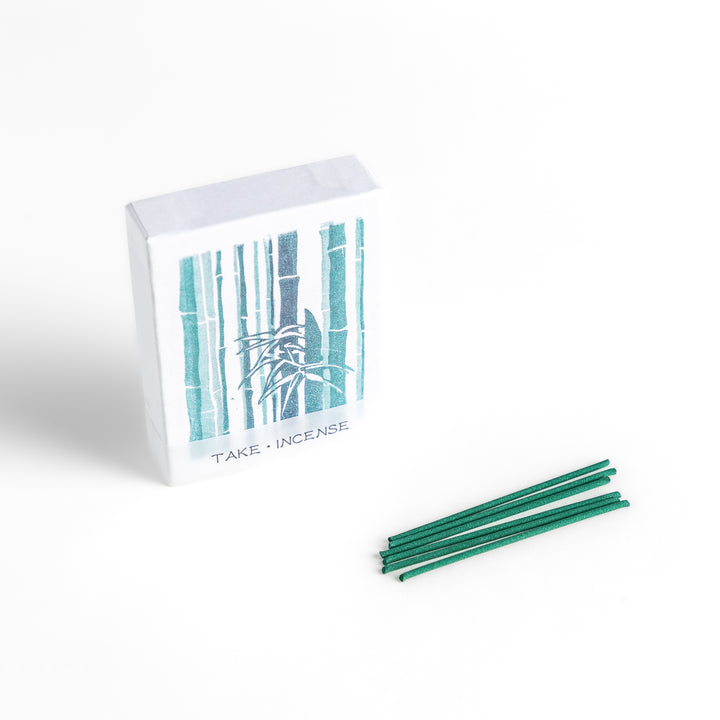 Incense featuring deep green sticks in a box adorned with a traditional Japanese bamboo design, offering a fresh and calming fragrance inspired by nature.