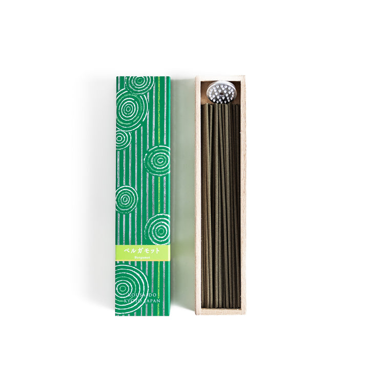 Citrusy Bergamot Incense in a light wooden box with earthy green sticks, elegantly packaged in a vibrant green design featuring white circular patterns, evoking a fresh and uplifting citrus aroma.