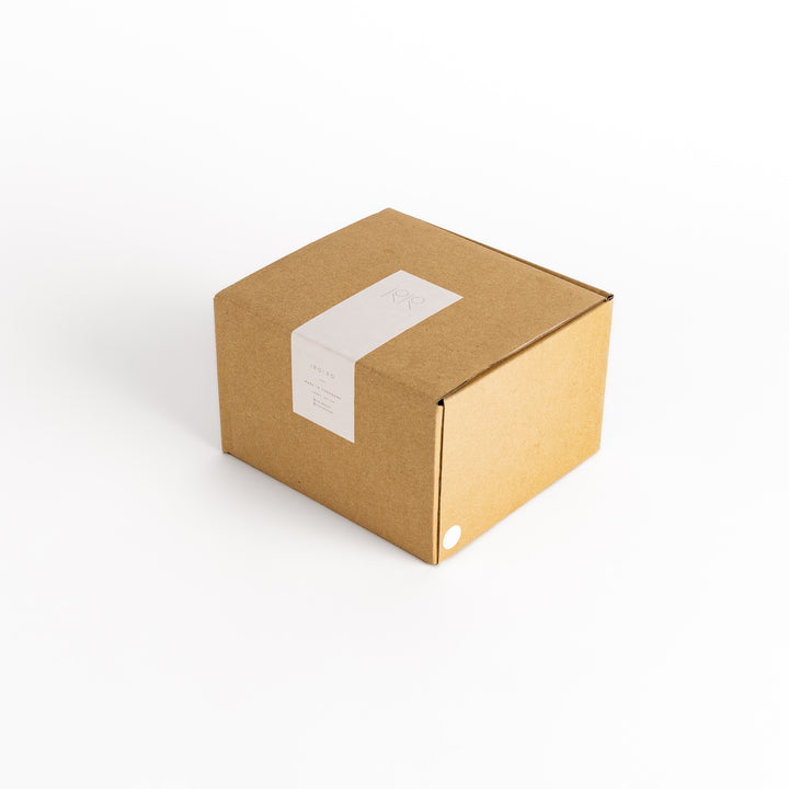 Packaging box for the beige teapot, featuring a sleek design that protects and complements the product.