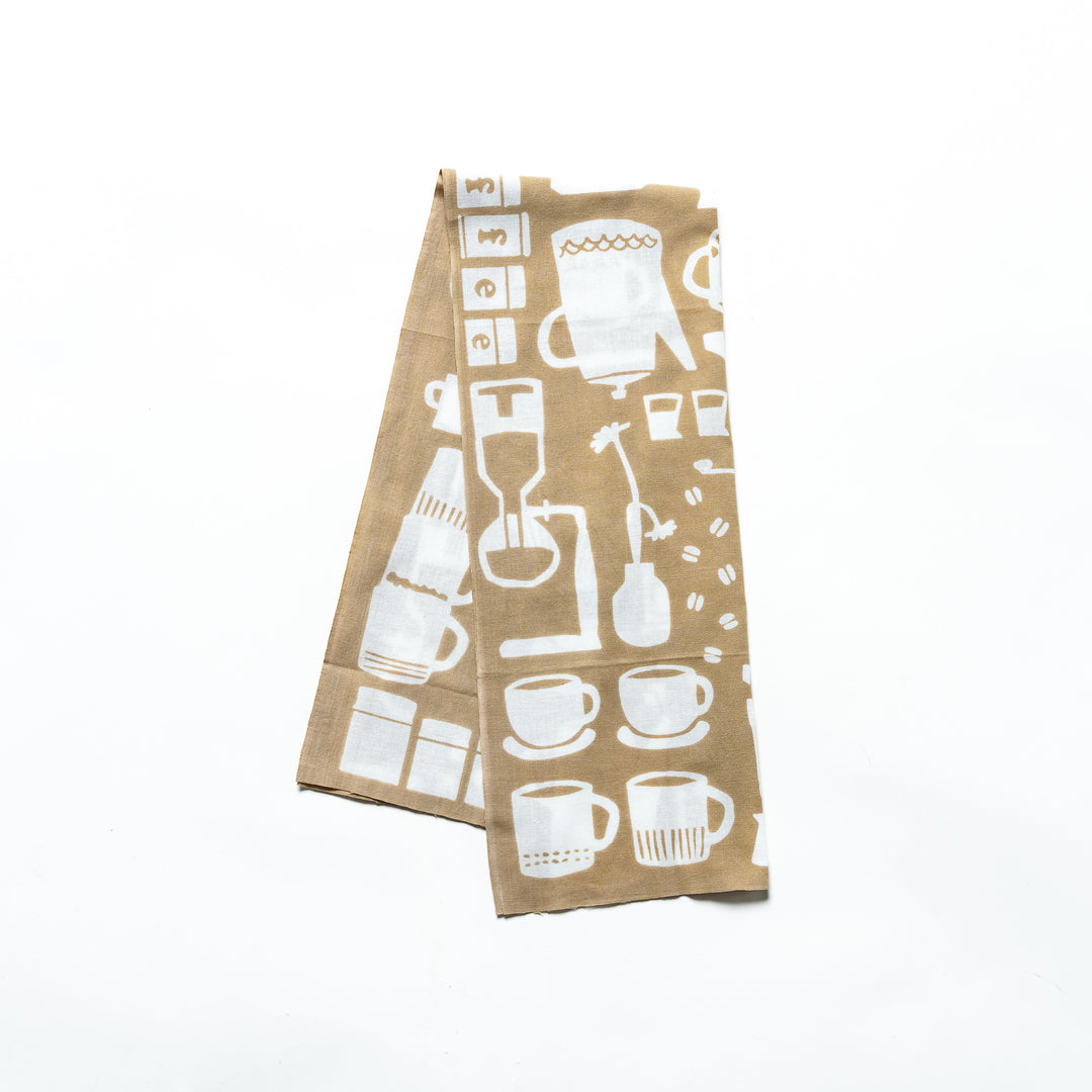 A beige tenugui hand towel with white coffee-themed patterns, including coffee cups, pots, and barista tools.