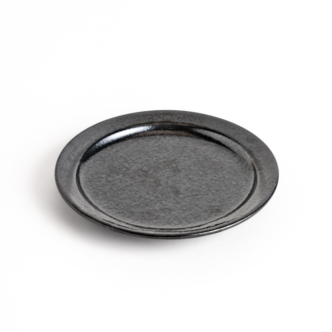 Black ceramic dessert plate with a glossy finish and minimalist design, perfect for serving small treats or appetizers elegantly.