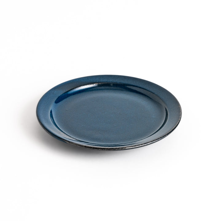 Blue ceramic dessert plate with a glossy finish and minimalist design, perfect for serving small treats or appetizers elegantly.