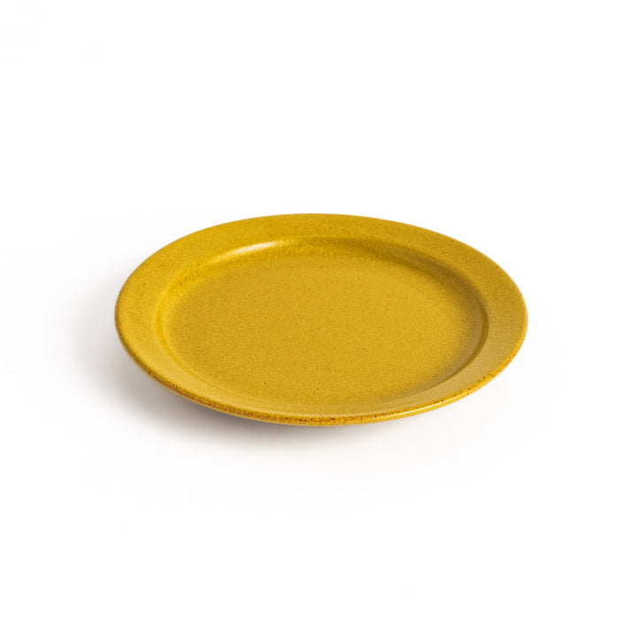 Yellow ceramic dessert plate with a glossy finish and minimalist design, perfect for serving small treats or appetizers elegantly.