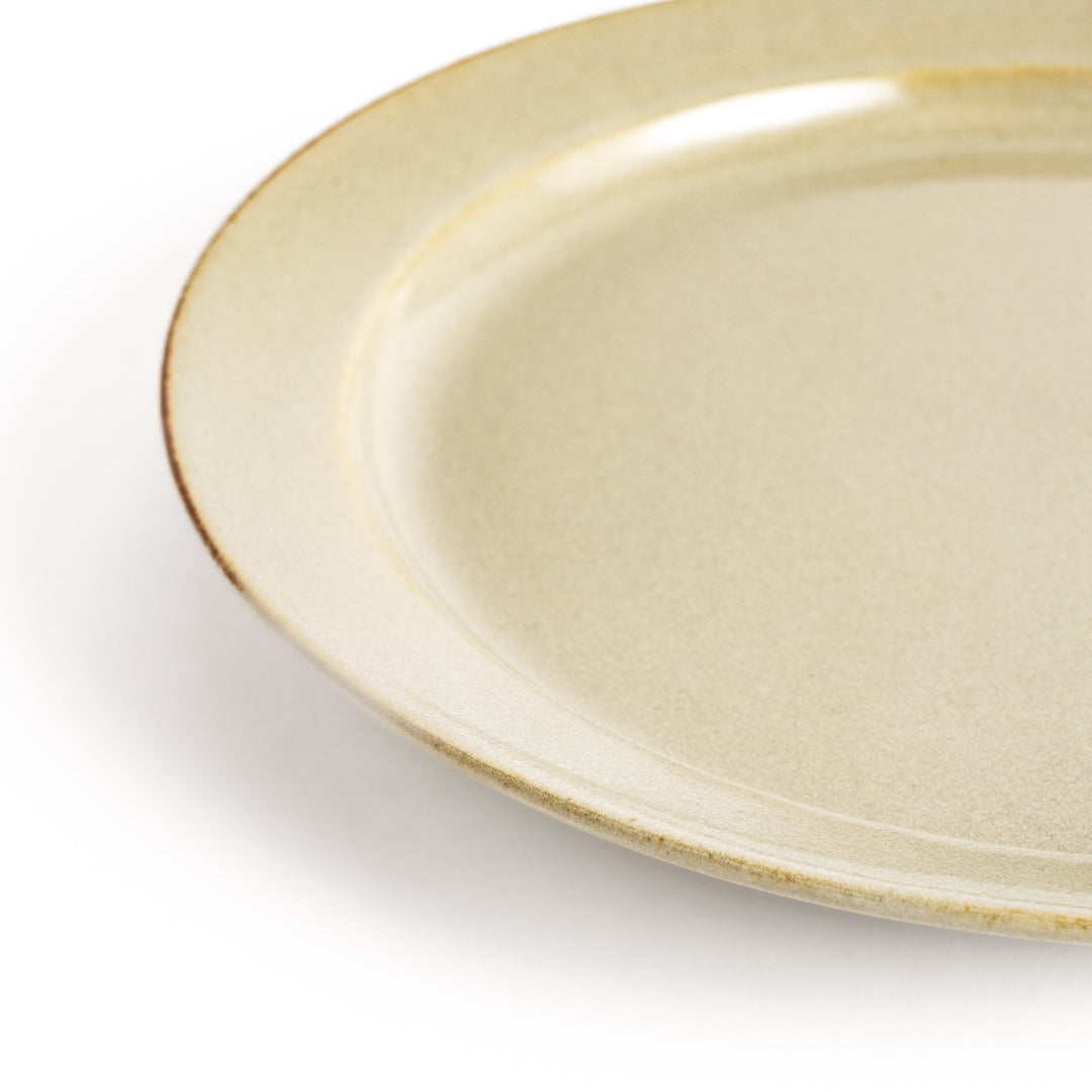 White ceramic dinner plate with a glossy finish, offering a clean and timeless design perfect for various table settings.