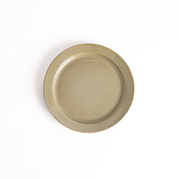 White ceramic dinner plate with a glossy finish, offering a clean and timeless design perfect for various table settings.