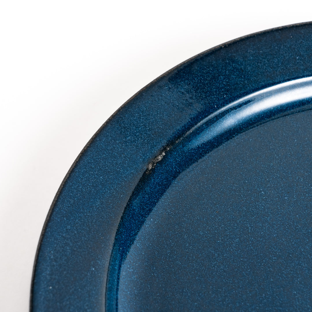 Blue ceramic dinner plate with a glossy finish, featuring a deep, calming tone that complements a modern table setting.