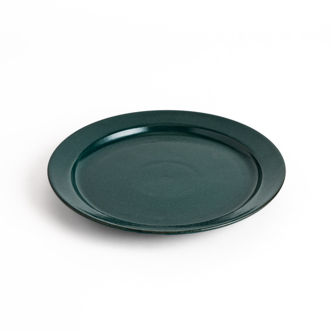 Green ceramic dinner plate with a glossy finish, showcasing a refreshing color that enhances natural or earthy table decor.