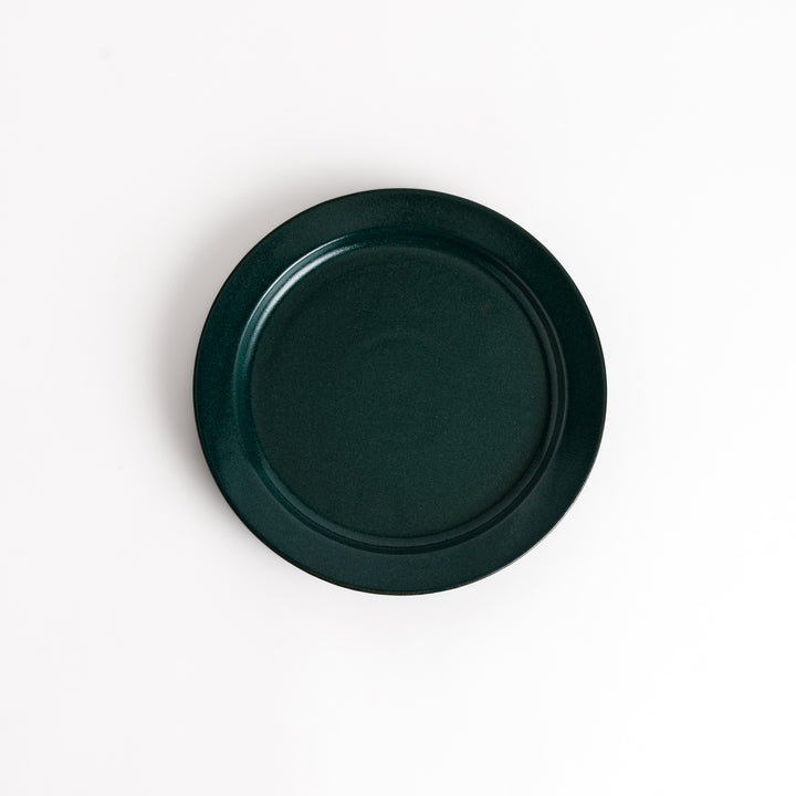 Green ceramic dinner plate with a glossy finish, showcasing a refreshing color that enhances natural or earthy table decor.