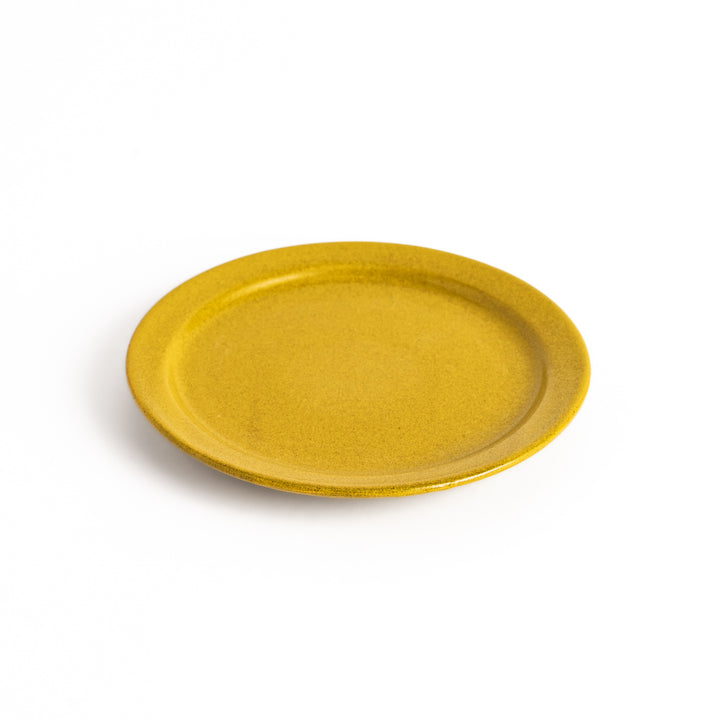 Elegant yellow salad plate with a smooth matte glaze, perfect for presenting salads or side dishes stylishly.