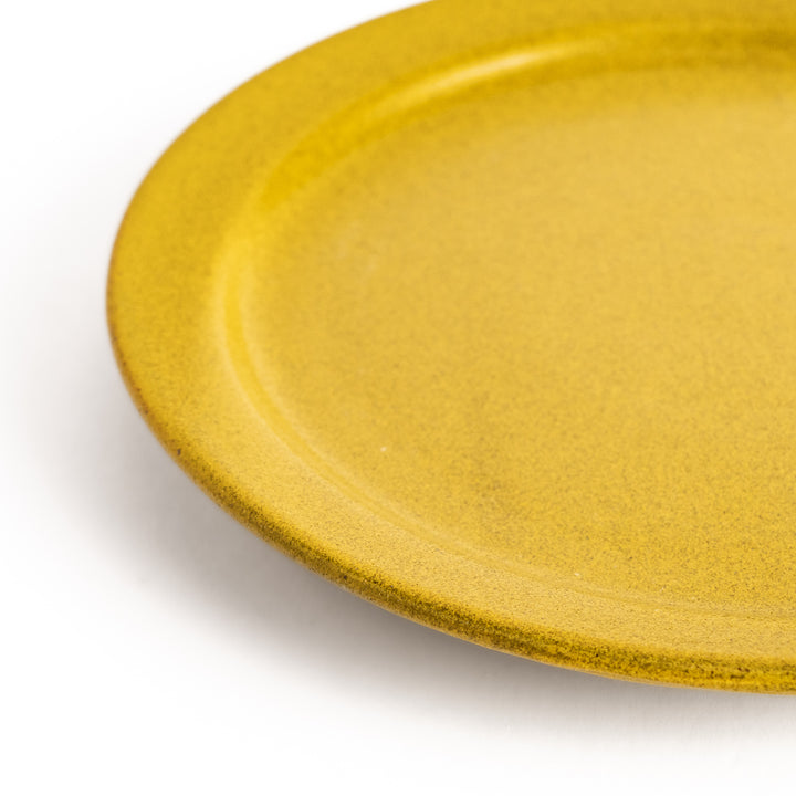 Elegant yellow salad plate with a smooth matte glaze, perfect for presenting salads or side dishes stylishly.