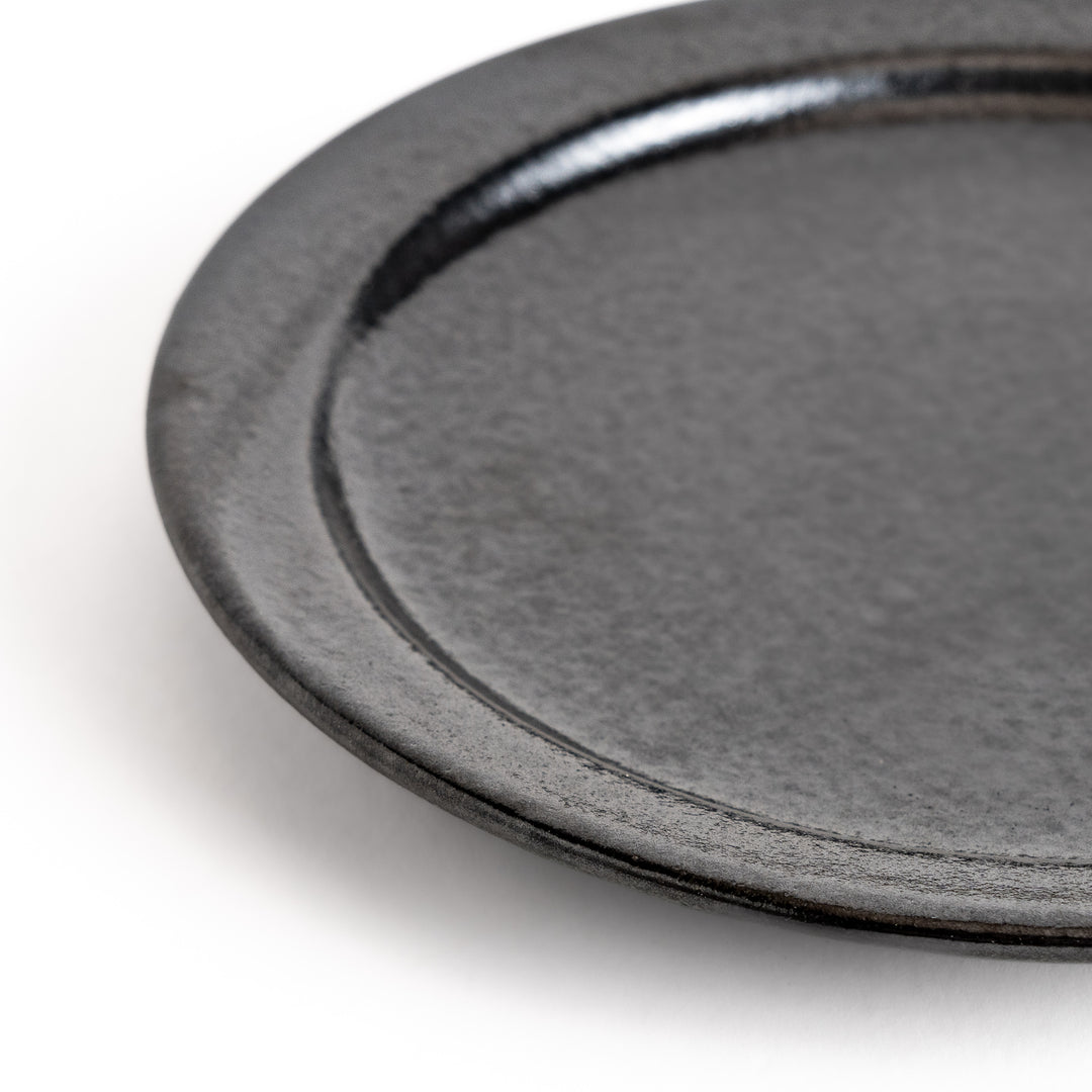 Elegant black salad plate with a smooth matte glaze, perfect for presenting salads or side dishes stylishly.