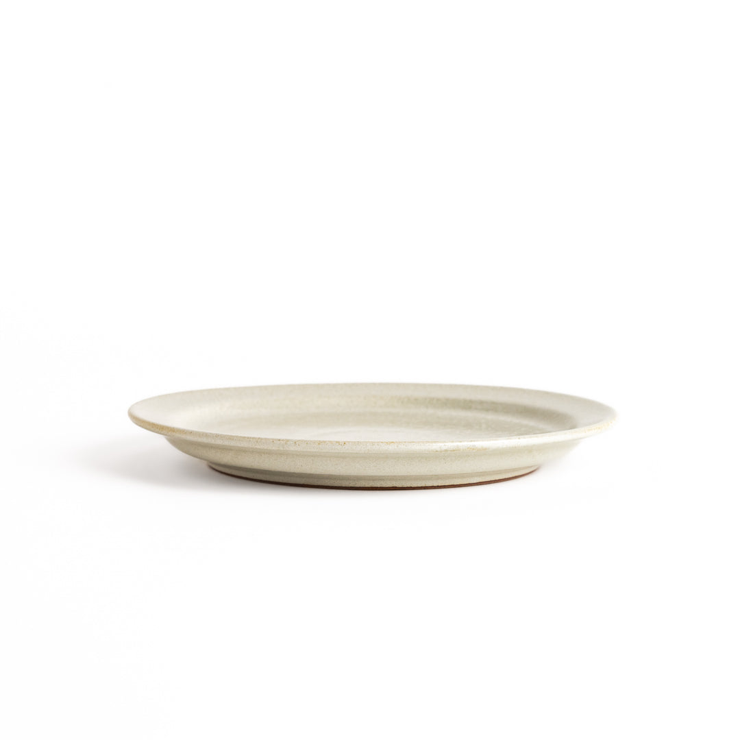 Elegant white salad plate with a smooth matte glaze, perfect for presenting salads or side dishes stylishly.