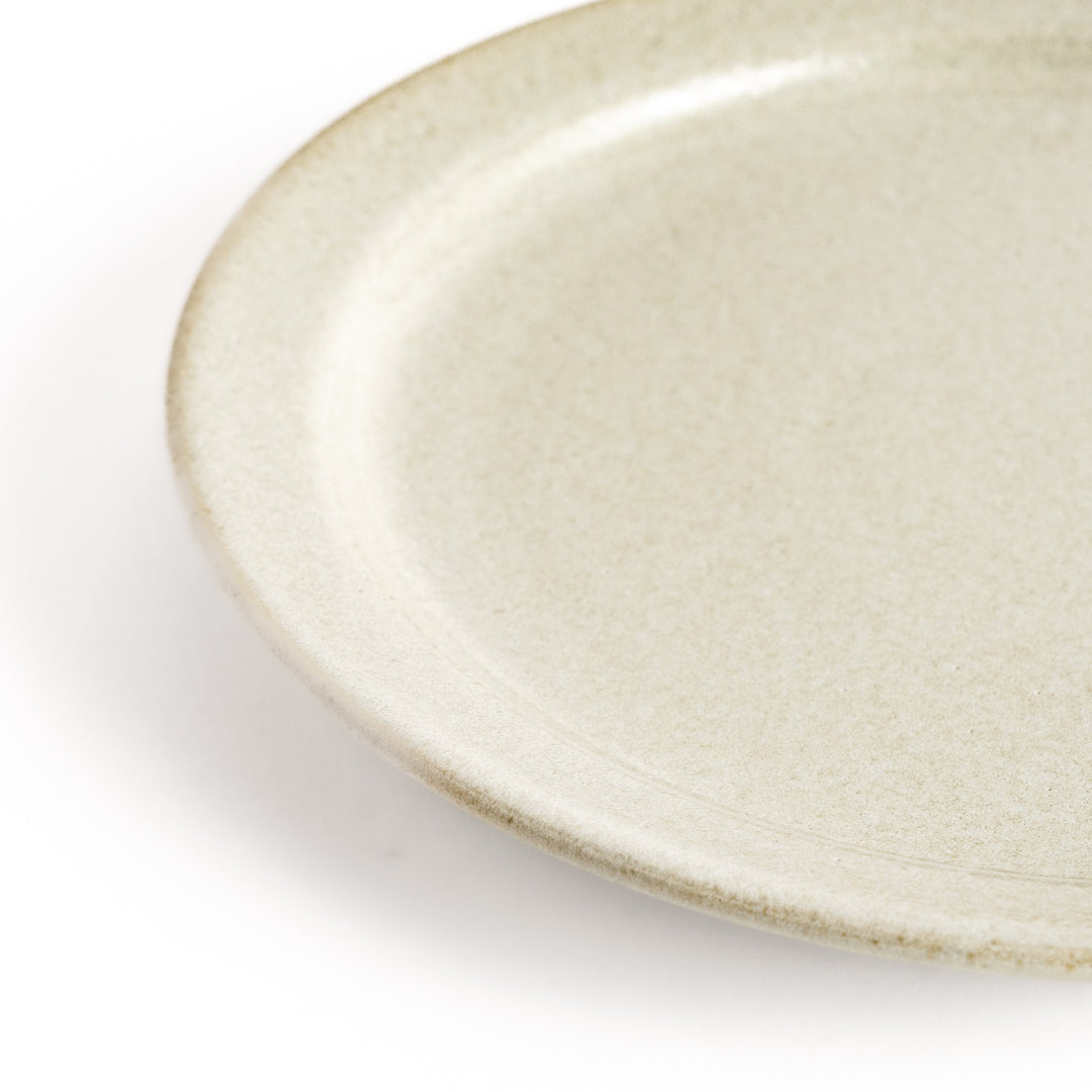 Elegant white salad plate with a smooth matte glaze, perfect for presenting salads or side dishes stylishly.