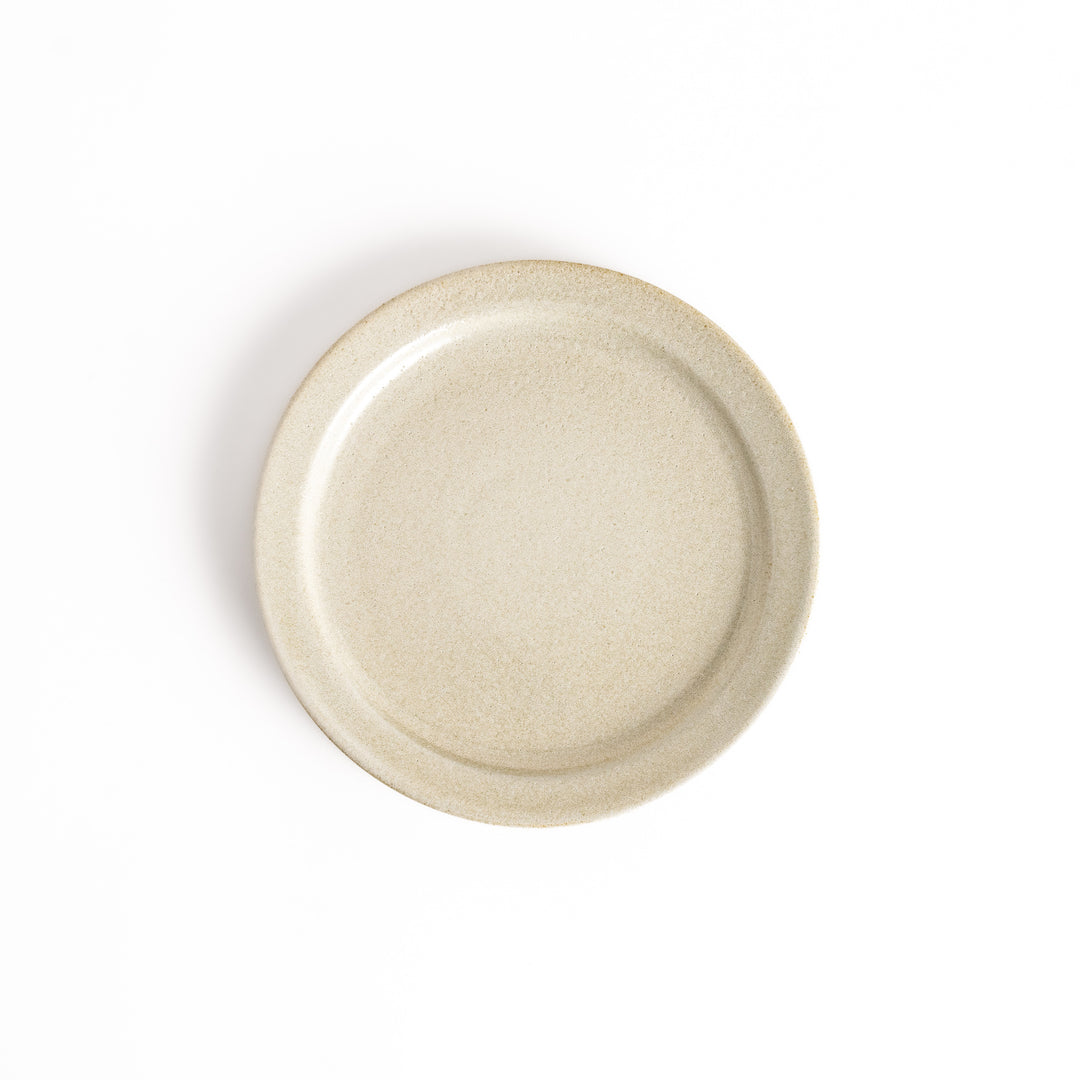 Elegant white salad plate with a smooth matte glaze, perfect for presenting salads or side dishes stylishly.