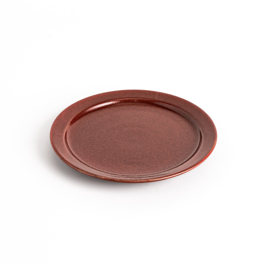 Elegant red salad plate with a smooth matte glaze, perfect for presenting salads or side dishes stylishly.