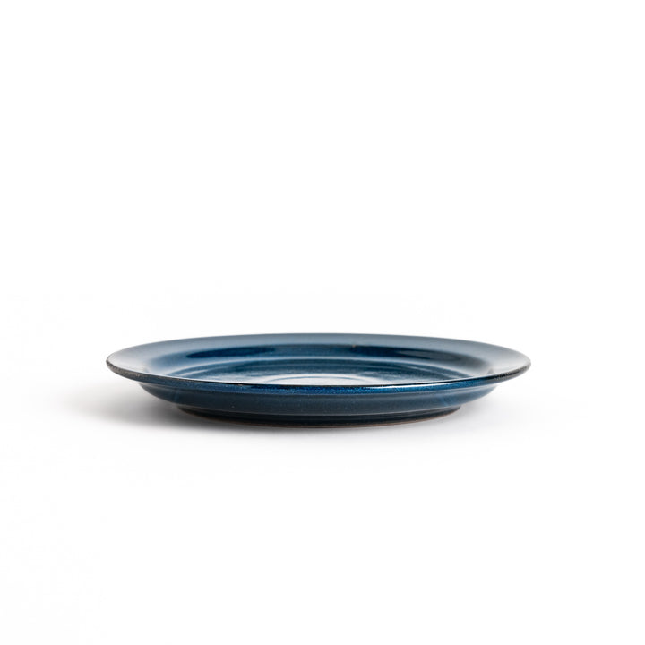 Elegant blue salad plate with a smooth matte glaze, perfect for presenting salads or side dishes stylishly.