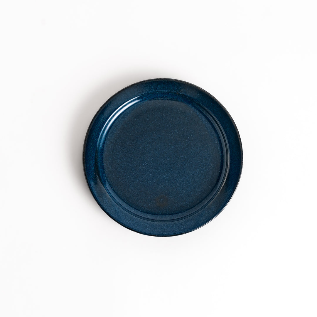 Elegant blue salad plate with a smooth matte glaze, perfect for presenting salads or side dishes stylishly.