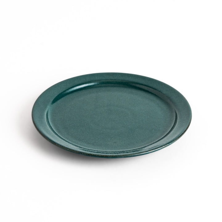 Elegant green salad plate with a smooth matte glaze, perfect for presenting salads or side dishes stylishly.