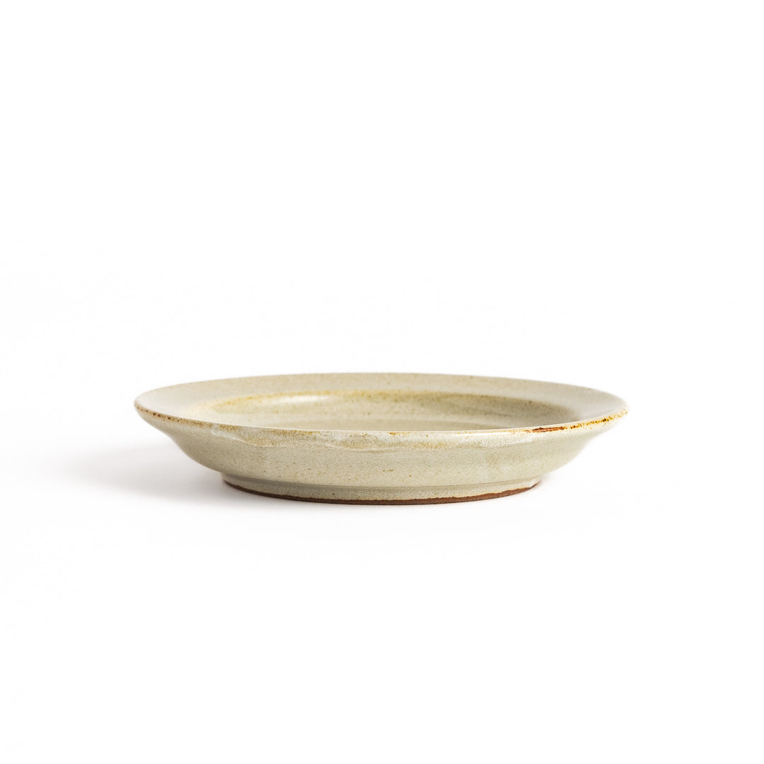 White ceramic sauce dish with a glossy finish and a minimalist design, ideal for serving dips or condiments elegantly.