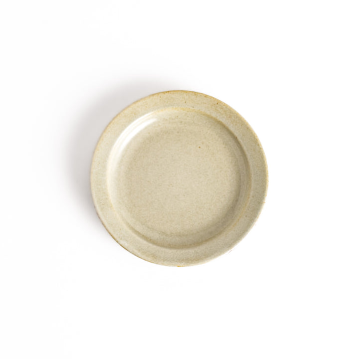 White ceramic sauce dish with a glossy finish and a minimalist design, ideal for serving dips or condiments elegantly.