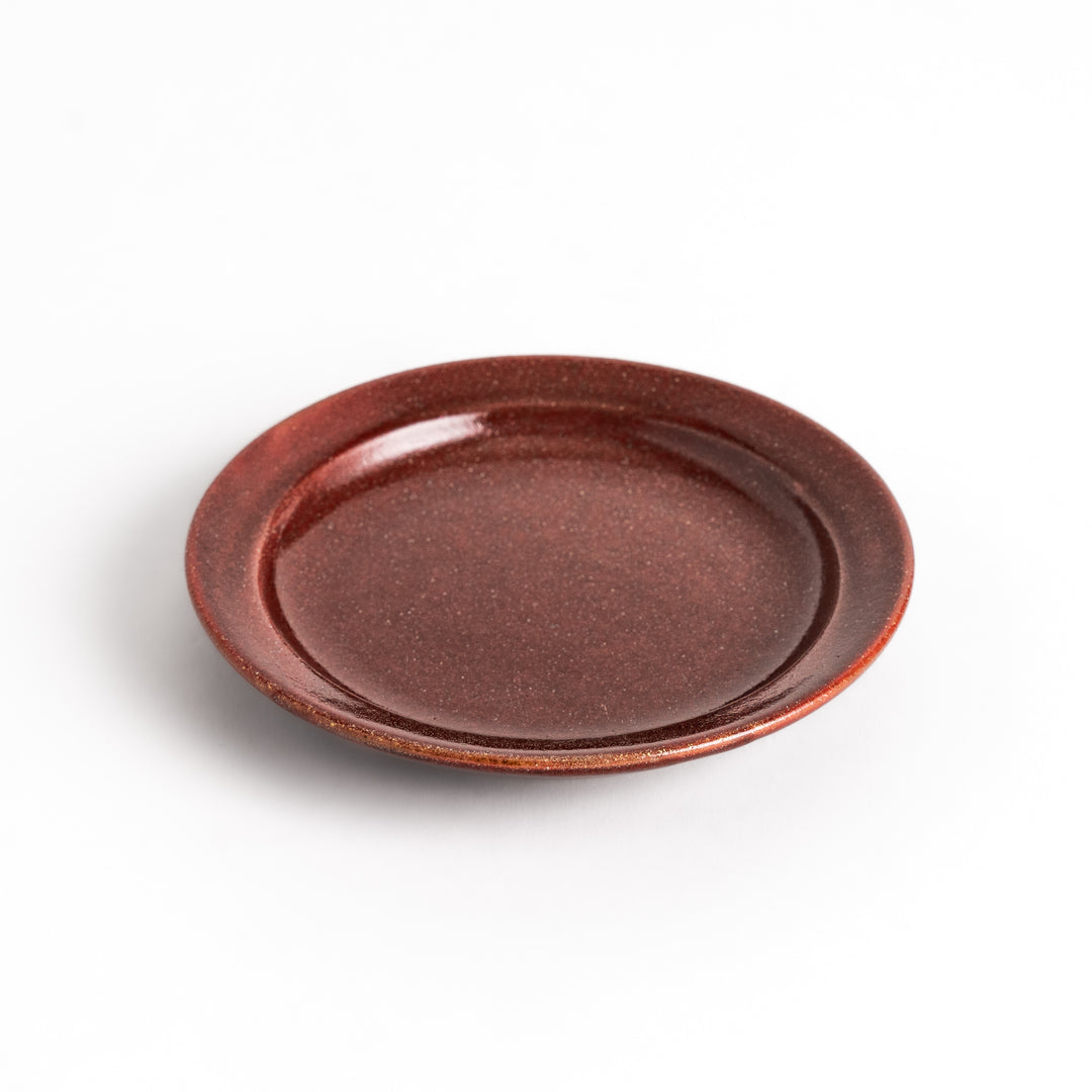 Red ceramic sauce dish with a glossy finish and a minimalist design, ideal for serving dips or condiments elegantly.