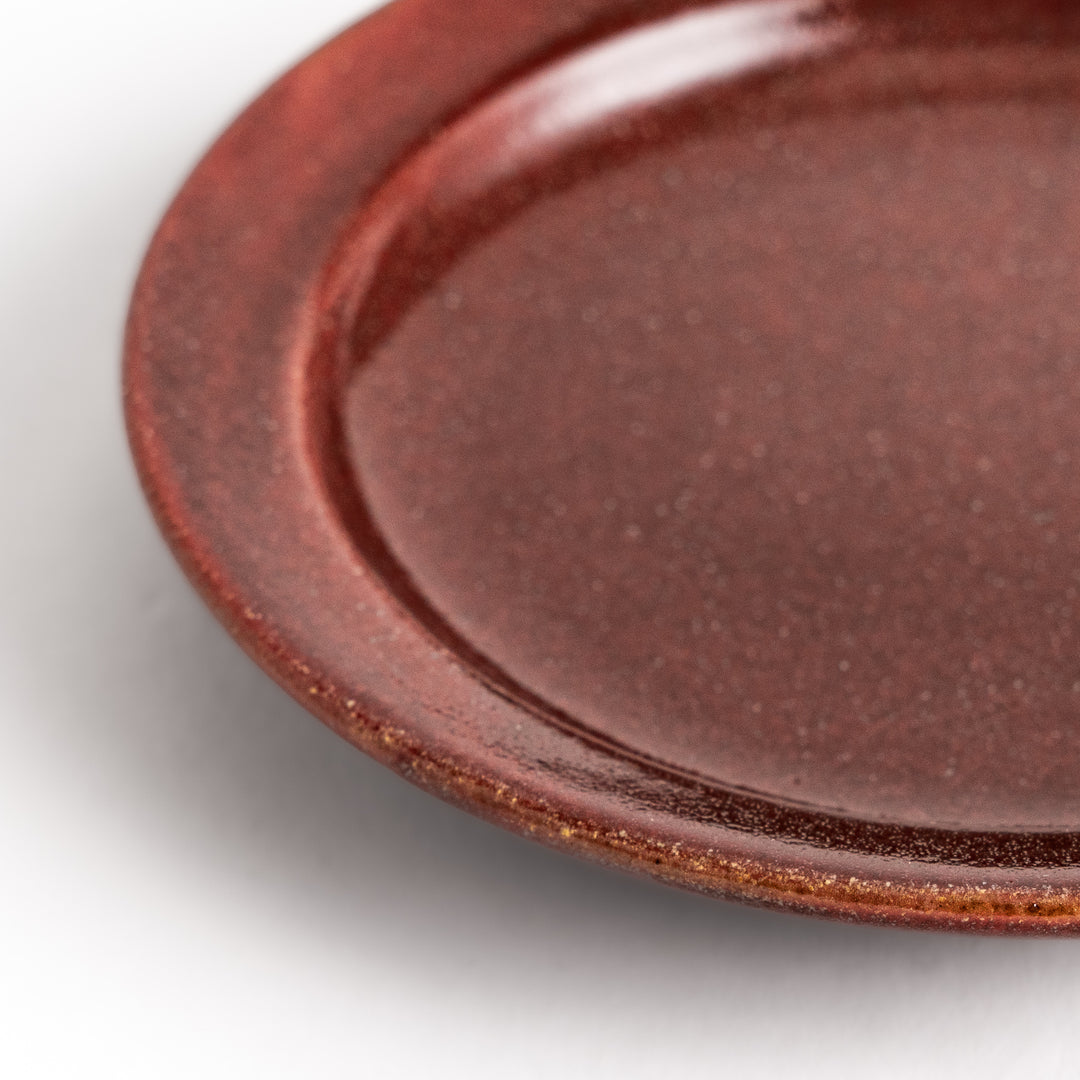 Red ceramic sauce dish with a glossy finish and a minimalist design, ideal for serving dips or condiments elegantly.