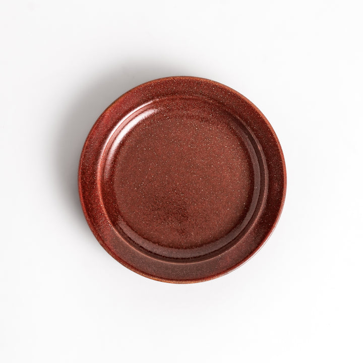 Red ceramic sauce dish with a glossy finish and a minimalist design, ideal for serving dips or condiments elegantly.