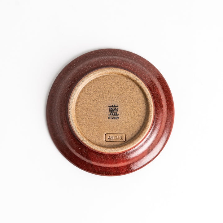 Red ceramic sauce dish with a glossy finish and a minimalist design, ideal for serving dips or condiments elegantly.