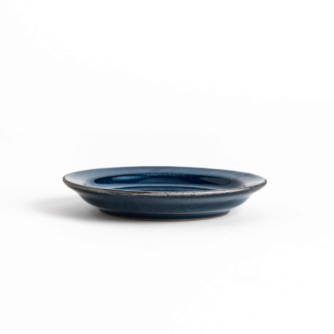 Blue ceramic sauce dish with a glossy finish and a minimalist design, ideal for serving dips or condiments elegantly.