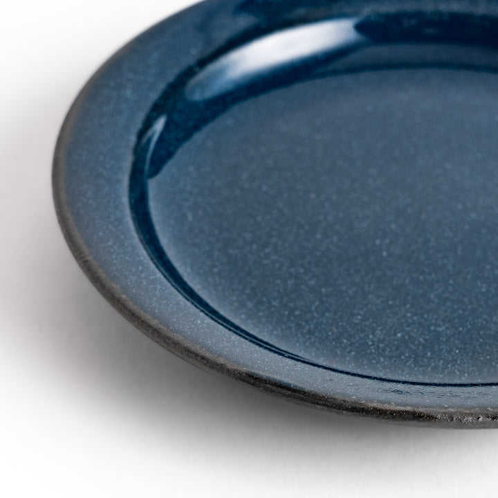 Blue ceramic sauce dish with a glossy finish and a minimalist design, ideal for serving dips or condiments elegantly.