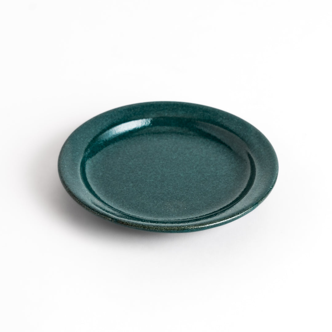 Green ceramic sauce dish with a glossy finish and a minimalist design, ideal for serving dips or condiments elegantly.