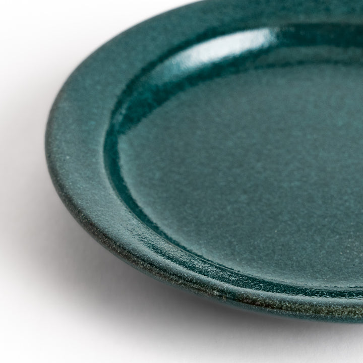 Green ceramic sauce dish with a glossy finish and a minimalist design, ideal for serving dips or condiments elegantly.