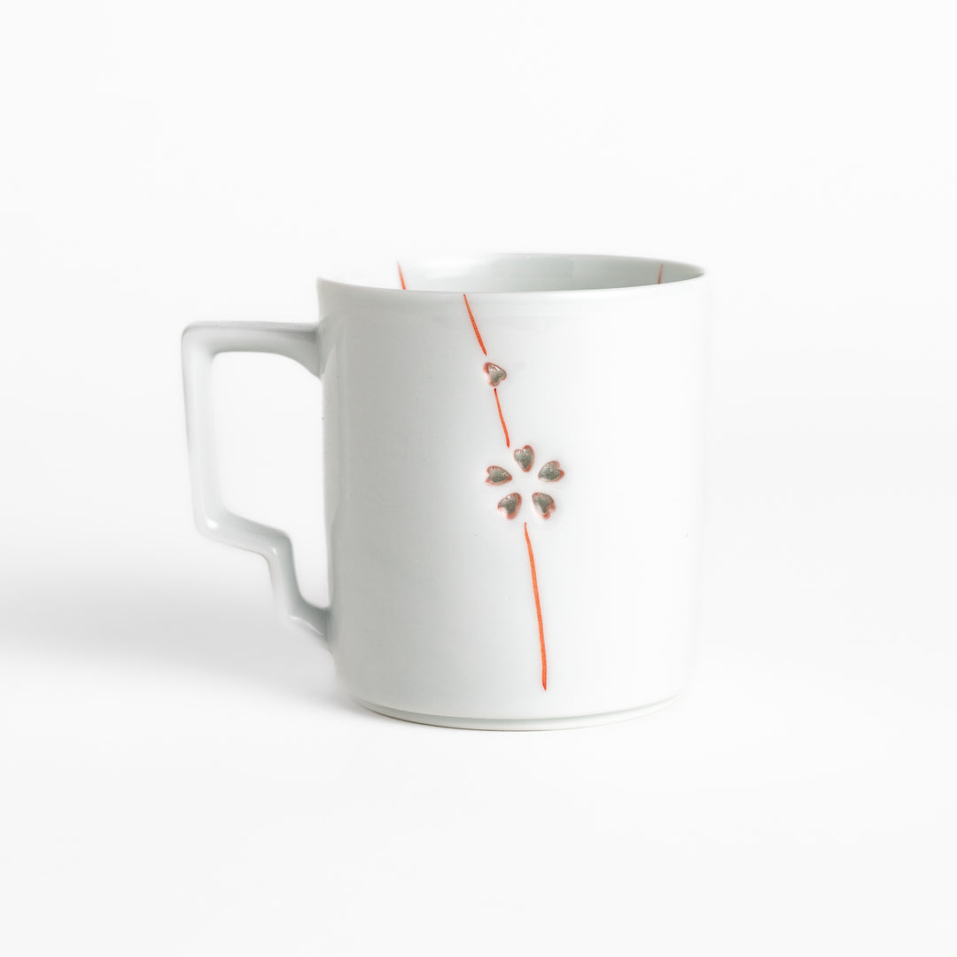 Elegant white ceramic mug with a subtle red floral pattern, ideal for enjoying your favorite hot beverages.