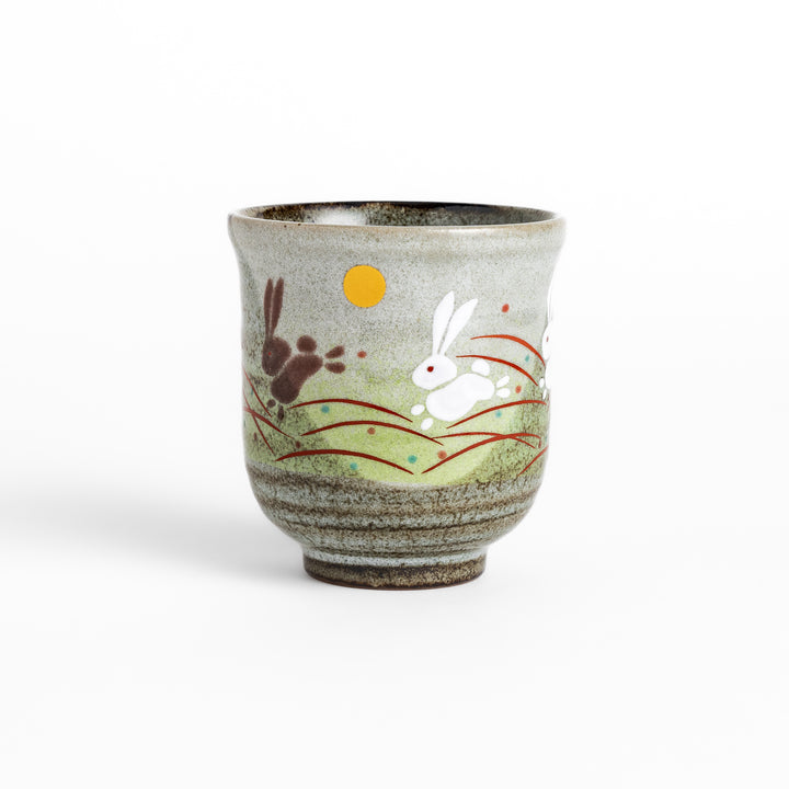 Authentic Japanese tea cups showcasing a delightful rabbit and sun motif, ideal for enjoying traditional Japanese tea.