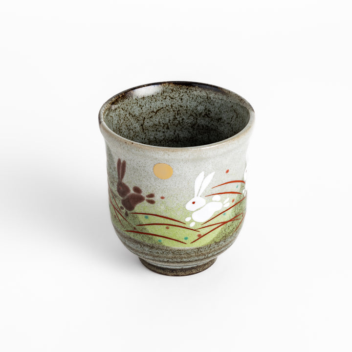 Authentic Japanese tea cups showcasing a delightful rabbit and sun motif, ideal for enjoying traditional Japanese tea.