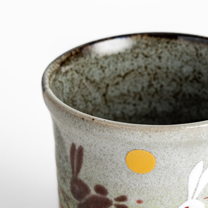 Authentic Japanese tea cups showcasing a delightful rabbit and sun motif, ideal for enjoying traditional Japanese tea.