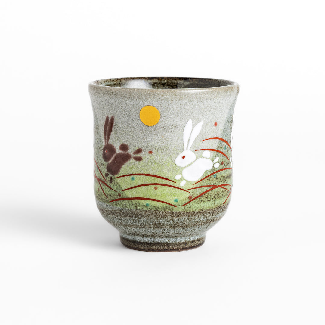 Authentic Japanese tea cups showcasing a delightful rabbit and sun motif, ideal for enjoying traditional Japanese tea.