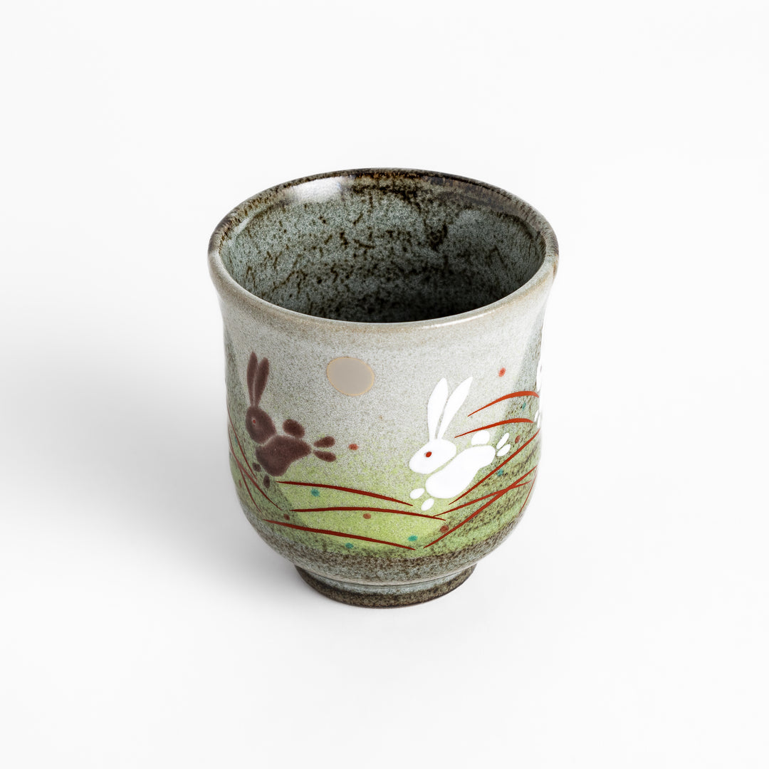 Authentic Japanese tea cups showcasing a delightful rabbit and sun motif, ideal for enjoying traditional Japanese tea.