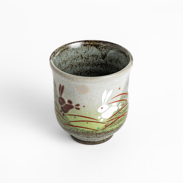 Authentic Japanese tea cups showcasing a delightful rabbit and sun motif, ideal for enjoying traditional Japanese tea.