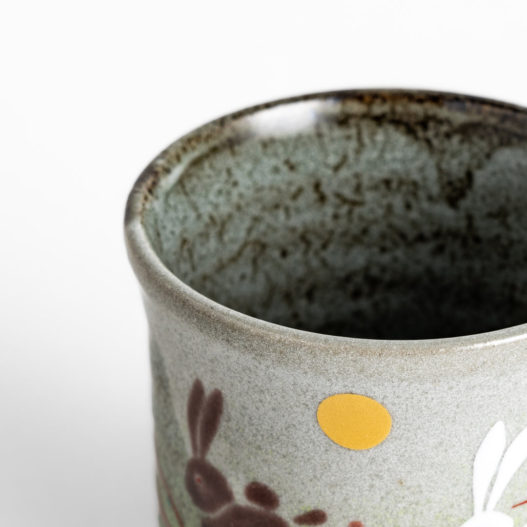 Authentic Japanese tea cups showcasing a delightful rabbit and sun motif, ideal for enjoying traditional Japanese tea.