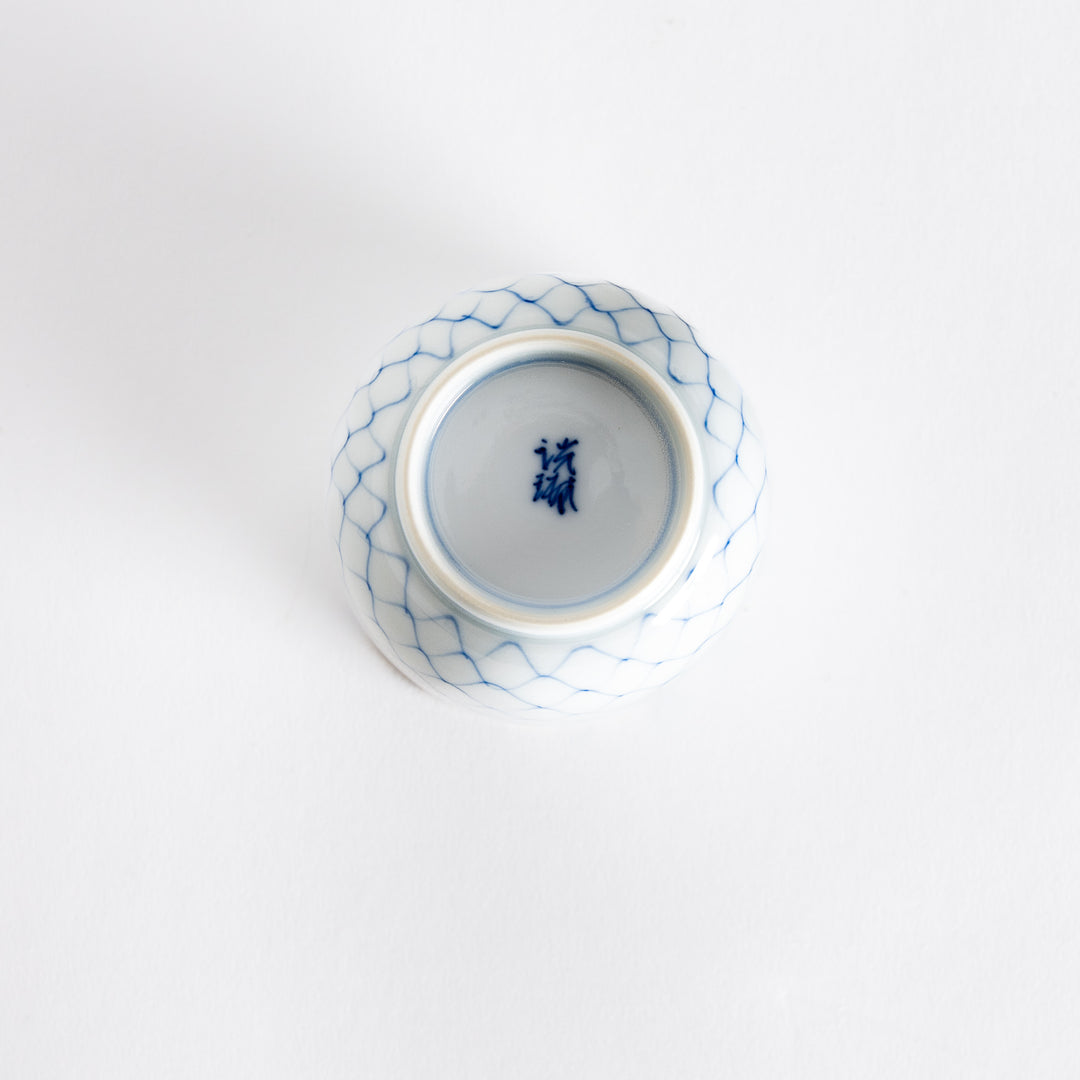 Bottom view of the tea cup showing its small circular base and subtle continuation of the pattern.