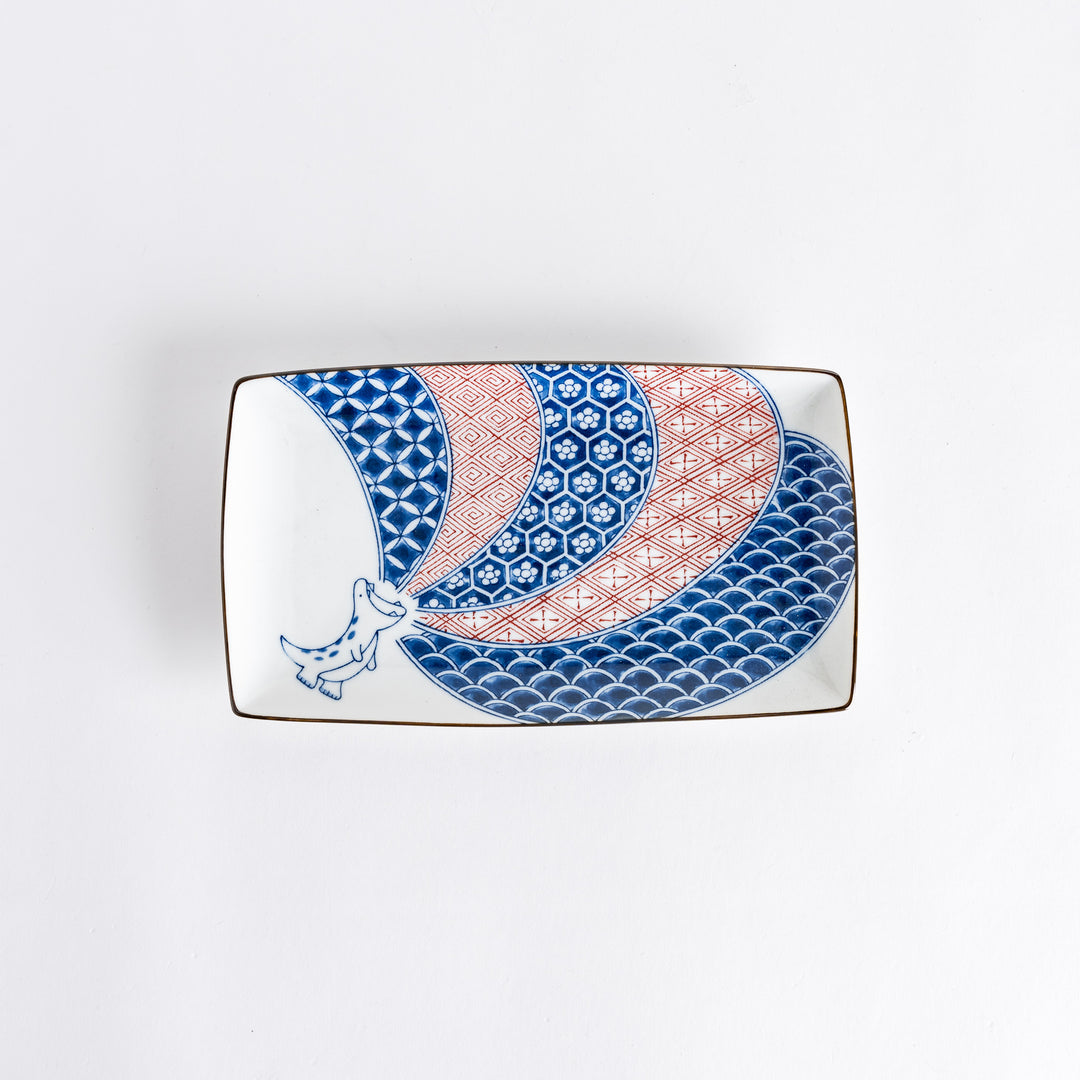 Rectangular dessert plate featuring playful dinosaur design, colorful patterns of red and blue in geometric shapes.