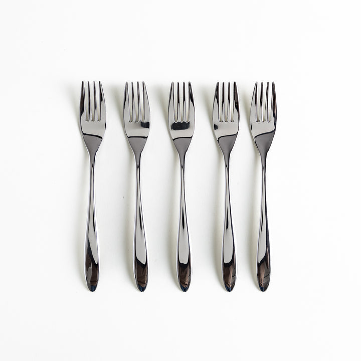 Five elegant stainless steel forks arranged vertically on a white background.