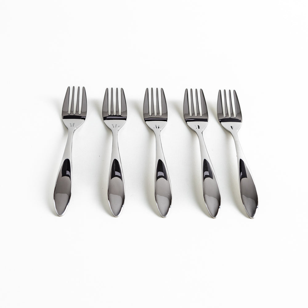 Five stainless steel forks aligned horizontally, showcasing their sleek handles.