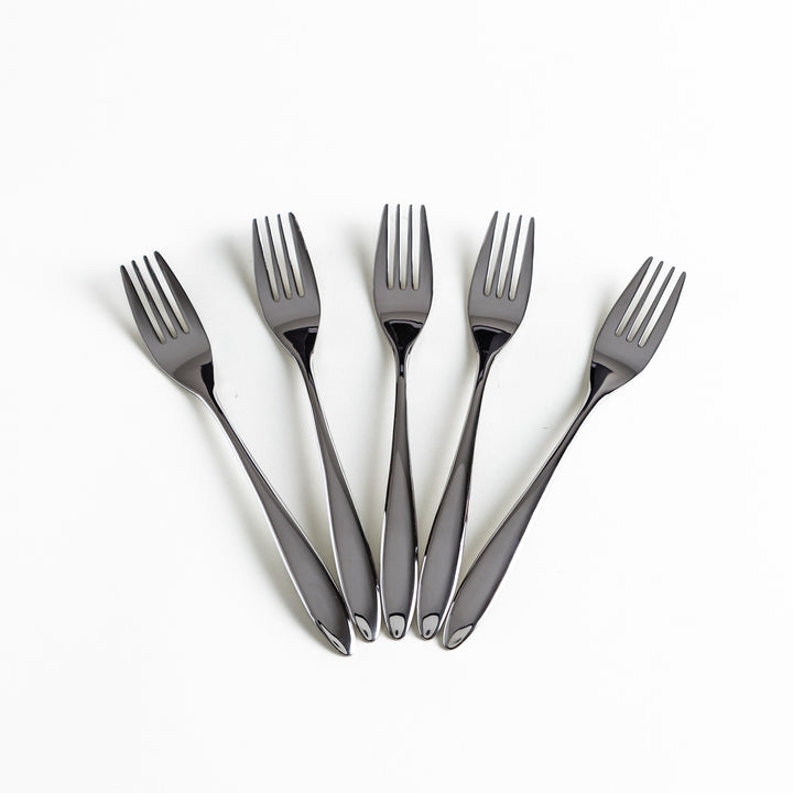 Fan arrangement of five stainless steel forks, displaying their glossy finish.