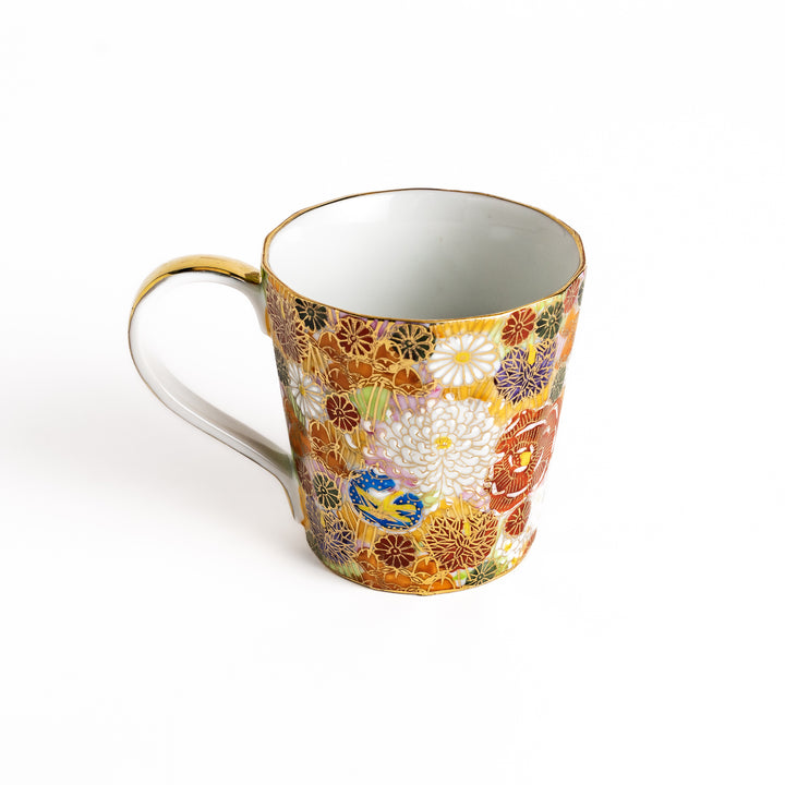 Elegant ceramic mug with a vibrant floral pattern in gold and pastel colors, perfect for adding a touch of sophistication to your daily routine.