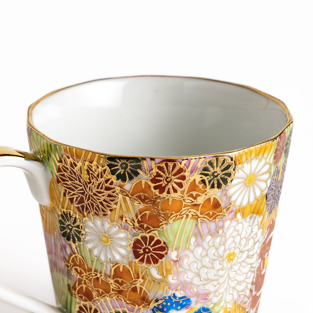 Elegant ceramic mug with a vibrant floral pattern in gold and pastel colors, perfect for adding a touch of sophistication to your daily routine.