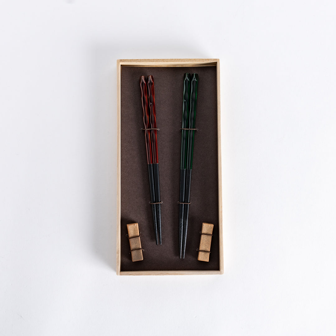 Set of carved chopsticks featuring Ember's deep red tone and Forest's rich green, perfect for elegant dining.